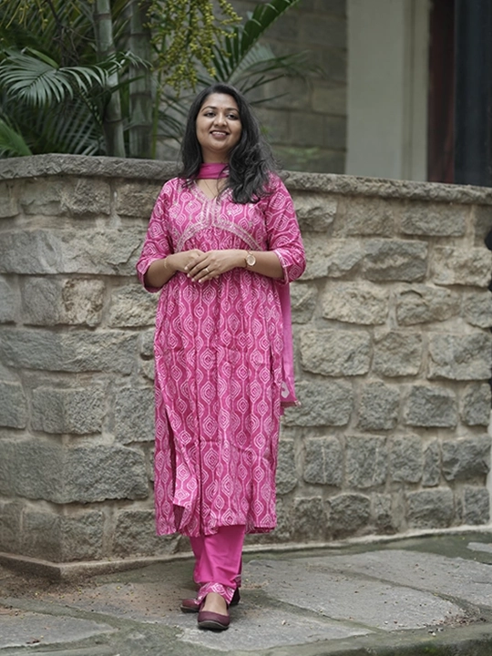 pink alia cut printed churidar set