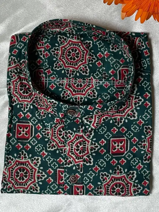 green printed half sleeve shirt folded